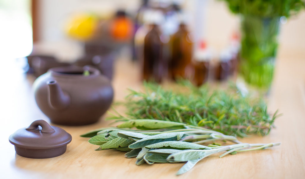 Tea pot with fresh herbs